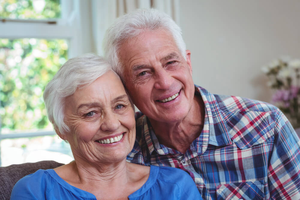 a senior couple smiles in st cloud assisted living facilities