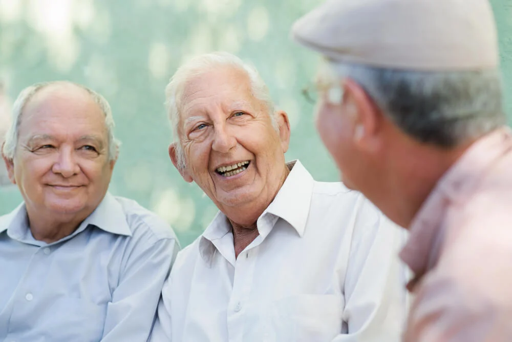 Three men enjoy a independent senior  living facility in Minnesota.