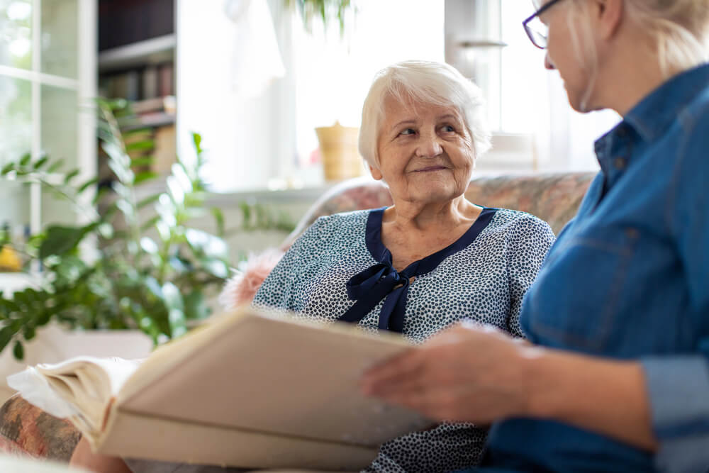 An elderly woman enjoys her senior assisted living facility in Crosslake, Minnesota.