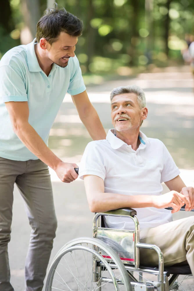 A man visits his father in a memory care facility near crosslake mn